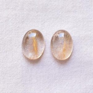 Shop Rutilated Quartz Earrings! Golden Rutile Quartz, Smooth Oval Shape Rutile Gemstone, Rutile Earring Pairs, Flat Back, Rutilated Quartz Cabochon, 12x16mm #PP9286 | Natural genuine Rutilated Quartz earrings. Buy crystal jewelry, handmade handcrafted artisan jewelry for women.  Unique handmade gift ideas. #jewelry #beadedearrings #beadedjewelry #gift #shopping #handmadejewelry #fashion #style #product #earrings #affiliate #ad