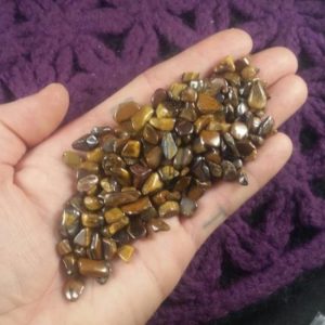 Shop Tumbled Tiger Eye Crystals & Pocket Stones! 50g Gold Tiger Eye Tumbled Chips Stones Polished Crystals small tiny chips pebbles bulk gridding parcel wholesale xs roller ball vial | Natural genuine stones & crystals in various shapes & sizes. Buy raw cut, tumbled, or polished gemstones for making jewelry or crystal healing energy vibration raising reiki stones. #crystals #gemstones #crystalhealing #crystalsandgemstones #energyhealing #affiliate #ad