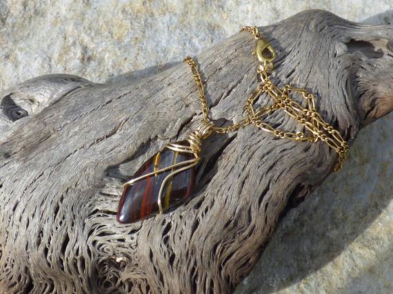Brown, Gold And Red Iron Tiger Eye Free Form Wire Wrapped Pendant In Brass Wire With An 18" Antique Gold Figaro Chain Necklace