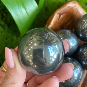 Shop Hematite Stones & Crystals! Hematite sphere, 40mm, focus, will power, courage | Natural genuine stones & crystals in various shapes & sizes. Buy raw cut, tumbled, or polished gemstones for making jewelry or crystal healing energy vibration raising reiki stones. #crystals #gemstones #crystalhealing #crystalsandgemstones #energyhealing #affiliate #ad