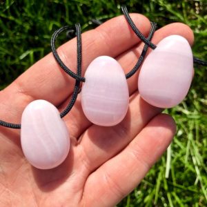 Mangano Calcite Necklace on 28" Black Cord – Pink Calcite Stone – Mangano Calcite Teardrop Pendant – Polished Teardrop – Healing Necklace | Natural genuine Pink Calcite jewelry. Buy crystal jewelry, handmade handcrafted artisan jewelry for women.  Unique handmade gift ideas. #jewelry #beadedjewelry #beadedjewelry #gift #shopping #handmadejewelry #fashion #style #product #jewelry #affiliate #ad