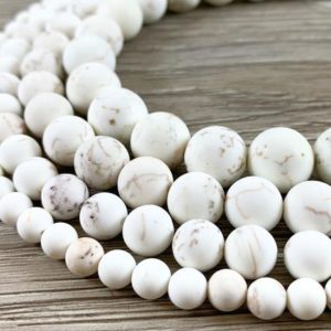 Shop Magnesite Beads! Natural Magnesite White Cream Color Matte Smooth Round Beads | Natural genuine round Magnesite beads for beading and jewelry making.  #jewelry #beads #beadedjewelry #diyjewelry #jewelrymaking #beadstore #beading #affiliate #ad