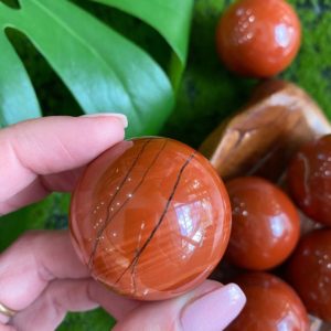 Shop Red Jasper Stones & Crystals! Red Jasper sphere, orb, 40mm, sacral chakra stone | Natural genuine stones & crystals in various shapes & sizes. Buy raw cut, tumbled, or polished gemstones for making jewelry or crystal healing energy vibration raising reiki stones. #crystals #gemstones #crystalhealing #crystalsandgemstones #energyhealing #affiliate #ad