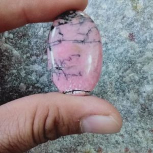 Shop Rhodonite Cabochons! Natural Rhodonite 22x35x5 oval shape cabochon Gemstone | Natural genuine stones & crystals in various shapes & sizes. Buy raw cut, tumbled, or polished gemstones for making jewelry or crystal healing energy vibration raising reiki stones. #crystals #gemstones #crystalhealing #crystalsandgemstones #energyhealing #affiliate #ad