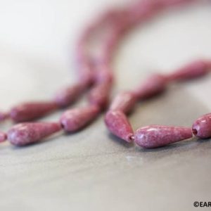 Shop Rhodonite Bead Shapes! S/ Rhodonite 6x16mm Teardrop beads 16" strand Natural pink gemstone beads for jewelry making | Natural genuine other-shape Rhodonite beads for beading and jewelry making.  #jewelry #beads #beadedjewelry #diyjewelry #jewelrymaking #beadstore #beading #affiliate #ad