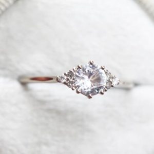 White sapphire engagement ring, Natural sapphire cluster, Round sapphire and salt pepper diamond ring | Natural genuine Array rings, simple unique alternative gemstone engagement rings. #rings #jewelry #bridal #wedding #jewelryaccessories #engagementrings #weddingideas #affiliate #ad