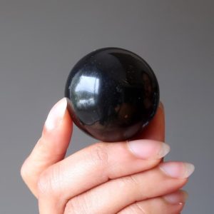 Shop Shungite Shapes! Shungite Sphere, Protection Stone Crystal Ball | Natural genuine stones & crystals in various shapes & sizes. Buy raw cut, tumbled, or polished gemstones for making jewelry or crystal healing energy vibration raising reiki stones. #crystals #gemstones #crystalhealing #crystalsandgemstones #energyhealing #affiliate #ad