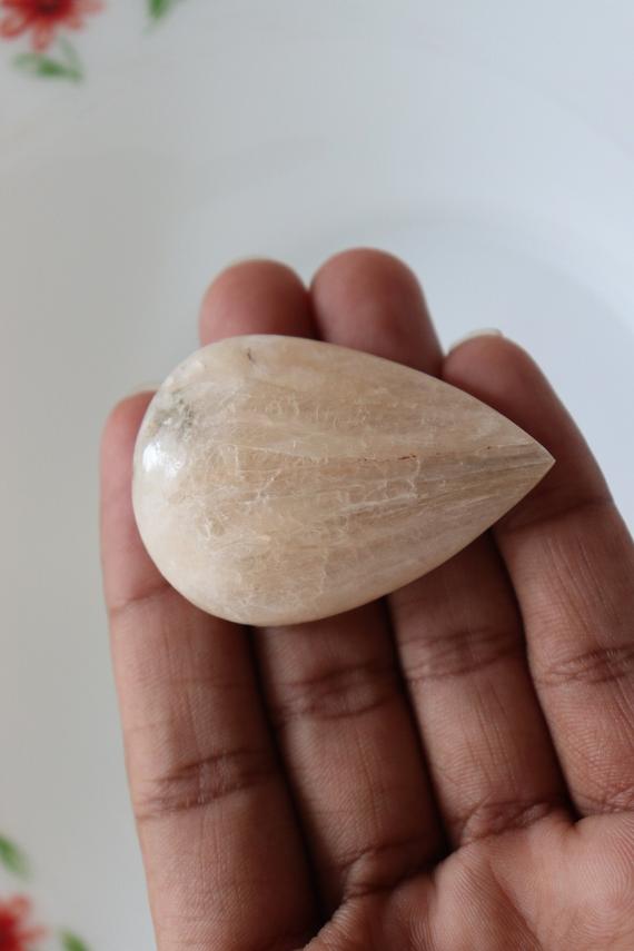 Stilbite Cabochon With Lots Of Healing Properties New Peach Stilbite With Chatoyant Crystal Cabochon Dimensions-55x38x14mm Wt-29gm...