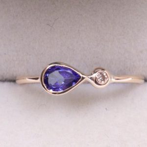 Tanzanite and diamond engagement  ring, Pear Cut Tanzanite engagement ring, 14k gold teardrop tanzanite ring , tanzanite stacking ring gold | Natural genuine Array rings, simple unique alternative gemstone engagement rings. #rings #jewelry #bridal #wedding #jewelryaccessories #engagementrings #weddingideas #affiliate #ad