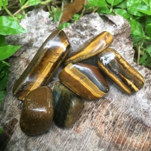 Shop Tumbled Tiger Eye Crystals & Pocket Stones! Tumbled Tigers Eye | Natural genuine stones & crystals in various shapes & sizes. Buy raw cut, tumbled, or polished gemstones for making jewelry or crystal healing energy vibration raising reiki stones. #crystals #gemstones #crystalhealing #crystalsandgemstones #energyhealing #affiliate #ad