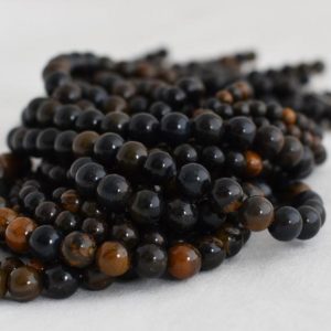 Shop Tiger Iron Beads! Natural Blue Iron Tiger Eye Semi-precious Gemstone Round Beads – 4mm, 6mm, 8mm, 10mm sizes – 15" strand | Natural genuine round Tiger Iron beads for beading and jewelry making.  #jewelry #beads #beadedjewelry #diyjewelry #jewelrymaking #beadstore #beading #affiliate #ad
