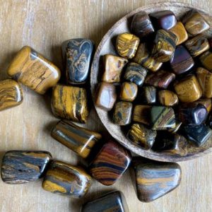 Shop Tiger Iron Stones & Crystals! Tiger Iron Tumbled Stone | Natural genuine stones & crystals in various shapes & sizes. Buy raw cut, tumbled, or polished gemstones for making jewelry or crystal healing energy vibration raising reiki stones. #crystals #gemstones #crystalhealing #crystalsandgemstones #energyhealing #affiliate #ad