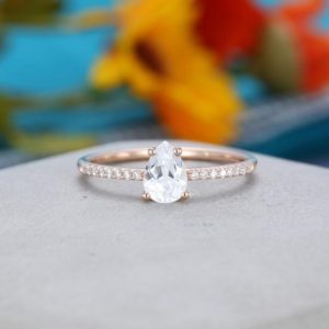 Shop White Sapphire Jewelry! White sapphire engagement ring rose gold pear shaped Unique engagement ring vintage Diamond Half eternity wedding Bridal Anniversary gift | Natural genuine White Sapphire jewelry. Buy handcrafted artisan wedding jewelry.  Unique handmade bridal jewelry gift ideas. #jewelry #beadedjewelry #gift #crystaljewelry #shopping #handmadejewelry #wedding #bridal #jewelry #affiliate #ad