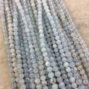 Shop Aquamarine Round Beads! 4-5mm Glossy Finish Natural Light Blue Aquamarine Round/Ball Shaped Beads with 1mm Holes – Sold by 15.75" Strands (Approximately 88 Beads) | Natural genuine round Aquamarine beads for beading and jewelry making.  #jewelry #beads #beadedjewelry #diyjewelry #jewelrymaking #beadstore #beading #affiliate #ad