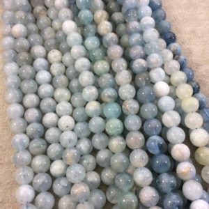 Shop Aquamarine Round Beads! 8mm Glossy Finish Natural Light Blue Aquamarine Round/Ball Shaped Beads with 1mm Holes – Sold by 15.5" Strands (Approximately 50 Beads) | Natural genuine round Aquamarine beads for beading and jewelry making.  #jewelry #beads #beadedjewelry #diyjewelry #jewelrymaking #beadstore #beading #affiliate #ad