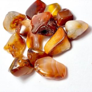 Shop Carnelian Stones & Crystals! Carnelian Tumbled Stones Madagascar | Natural genuine stones & crystals in various shapes & sizes. Buy raw cut, tumbled, or polished gemstones for making jewelry or crystal healing energy vibration raising reiki stones. #crystals #gemstones #crystalhealing #crystalsandgemstones #energyhealing #affiliate #ad