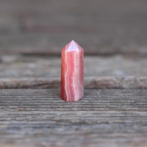 Shop Rhodochrosite Points & Wands! High Quality Rhodochrosite Point | Rhodochrosite Crystal Tower | Natural genuine stones & crystals in various shapes & sizes. Buy raw cut, tumbled, or polished gemstones for making jewelry or crystal healing energy vibration raising reiki stones. #crystals #gemstones #crystalhealing #crystalsandgemstones #energyhealing #affiliate #ad