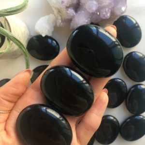 Shop Obsidian Stones & Crystals! Black Obsidian Palm Stone, Natural Black Obsidian, Polished Black Obsidian, Black Obsidian Pocket Stone, Healing Crystal, Black Obsidian | Natural genuine stones & crystals in various shapes & sizes. Buy raw cut, tumbled, or polished gemstones for making jewelry or crystal healing energy vibration raising reiki stones. #crystals #gemstones #crystalhealing #crystalsandgemstones #energyhealing #affiliate #ad