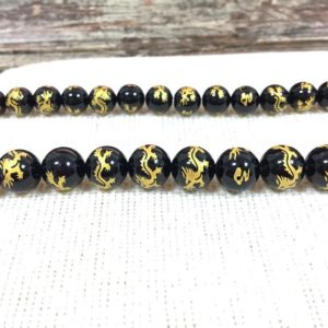 Black Onyx Round Beads Carved Dragon Beads 6mm 8mm 10mm 12mm 14mm Natural Black Gold Beads Painted Chinese Dragon Beads Full or Half Strand | Natural genuine round Onyx beads for beading and jewelry making.  #jewelry #beads #beadedjewelry #diyjewelry #jewelrymaking #beadstore #beading #affiliate #ad