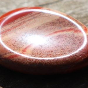 Shop Red Jasper Shapes! Red Jasper Carved Worry Healing Stone with a Thumb Indent with Positive Healing Energy! | Natural genuine stones & crystals in various shapes & sizes. Buy raw cut, tumbled, or polished gemstones for making jewelry or crystal healing energy vibration raising reiki stones. #crystals #gemstones #crystalhealing #crystalsandgemstones #energyhealing #affiliate #ad