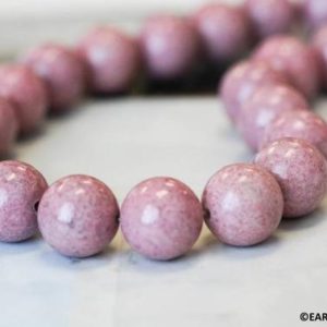 Shop Rhodonite Round Beads! L/ Rhodonite 16mm Round beads 15.5" strand Natural pink gemstone beads for jewelry making Shade varies | Natural genuine round Rhodonite beads for beading and jewelry making.  #jewelry #beads #beadedjewelry #diyjewelry #jewelrymaking #beadstore #beading #affiliate #ad