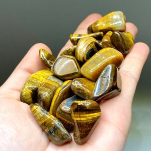 Shop Tumbled Tiger Eye Crystals & Pocket Stones! Tigers Eye Tumbled Stones – Small | Natural genuine stones & crystals in various shapes & sizes. Buy raw cut, tumbled, or polished gemstones for making jewelry or crystal healing energy vibration raising reiki stones. #crystals #gemstones #crystalhealing #crystalsandgemstones #energyhealing #affiliate #ad