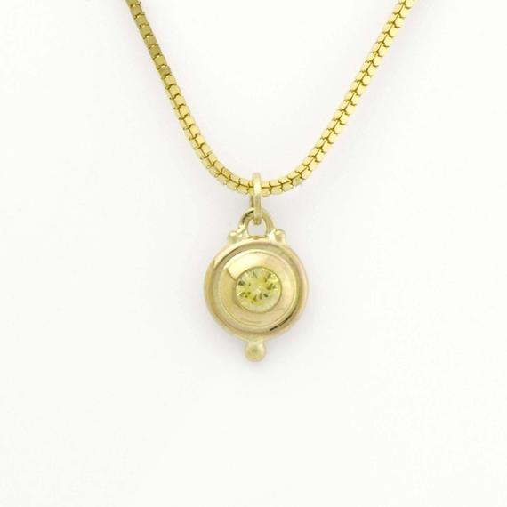Sapphire Charm In Lemon Yellow Surrounded By A Handmade Setting Using A Luxurious Amount Of Solid 14k Yellowgold