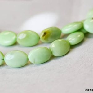 M/ Lemon Chrysoprase 10x14mm/ 13x18mm Flat Oval beads 16" strand Enhanced light green gemstone beads For jewelry making | Natural genuine other-shape Chrysoprase beads for beading and jewelry making.  #jewelry #beads #beadedjewelry #diyjewelry #jewelrymaking #beadstore #beading #affiliate #ad
