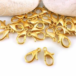 Shop Clasps for Making Jewelry! Gold Parrot Clasps, Gold Lobster Claw Clasp, 7x14mm, 22k Gold Plated, Jewelry Clasp Findings, Gold Necklace Clasp, Bracelet Clasp | Shop jewelry making and beading supplies, tools & findings for DIY jewelry making and crafts. #jewelrymaking #diyjewelry #jewelrycrafts #jewelrysupplies #beading #affiliate #ad
