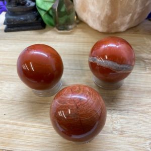 Shop Red Jasper Shapes! Red Jasper 40mm sphere crystal ball Shelf 8 | Natural genuine stones & crystals in various shapes & sizes. Buy raw cut, tumbled, or polished gemstones for making jewelry or crystal healing energy vibration raising reiki stones. #crystals #gemstones #crystalhealing #crystalsandgemstones #energyhealing #affiliate #ad