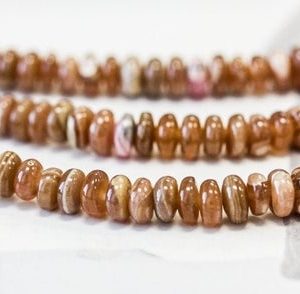 Shop Rhodochrosite Rondelle Beads! S/ Brown Rhodochrosite 6mm/ 5-5.5mm Rondelle 15.5" strand Natural Rhodochrosite beads For Jewelry Making Bulk discount @EARTHSTONE.COM | Natural genuine rondelle Rhodochrosite beads for beading and jewelry making.  #jewelry #beads #beadedjewelry #diyjewelry #jewelrymaking #beadstore #beading #affiliate #ad
