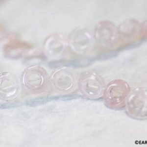 Shop Rose Quartz Bead Shapes! M/ Rose Quartz 10mm/ 14mm Donut beads 16" strand Shade varies Light to Pale Pink For jewelry making | Natural genuine other-shape Rose Quartz beads for beading and jewelry making.  #jewelry #beads #beadedjewelry #diyjewelry #jewelrymaking #beadstore #beading #affiliate #ad