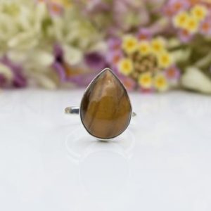 Shop Tiger Eye Rings! Tiger Eye Stone Ring, Sterling Silver Ring, Pear Stone Ring, Statement Ring, Cabochon Gemstone, Silver Band Ring, Natural Gemstone, Sale | Natural genuine Tiger Eye rings, simple unique handcrafted gemstone rings. #rings #jewelry #shopping #gift #handmade #fashion #style #affiliate #ad