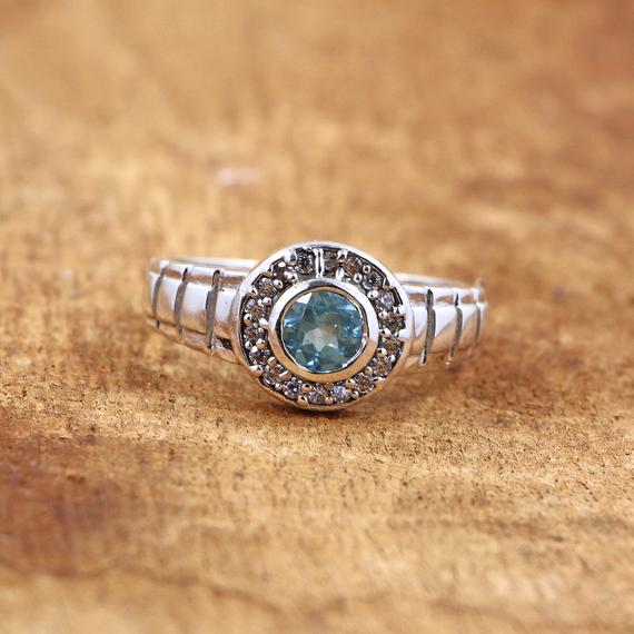 Blue Topaz Ring: Sterling Silver With Cubic Zirconia, 5mm Round Stone