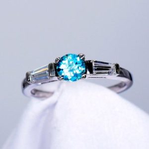 Shop Apatite Rings! Apatite Ring, Blue 5mm Round Faceted,  Genuine Gemstone, With 2 CZ Side Stones, Set in 925 Sterling Silver Mounting | Natural genuine Apatite rings, simple unique handcrafted gemstone rings. #rings #jewelry #shopping #gift #handmade #fashion #style #affiliate #ad
