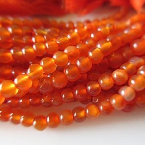 Shop Carnelian Round Beads! 13 Inch Strand Wholesale 4mm Smooth Carnelian Round Beads, Carnelian Gemstone Beads, Sold As 5 Strand/50 Strands, GDS542 | Natural genuine round Carnelian beads for beading and jewelry making.  #jewelry #beads #beadedjewelry #diyjewelry #jewelrymaking #beadstore #beading #affiliate #ad