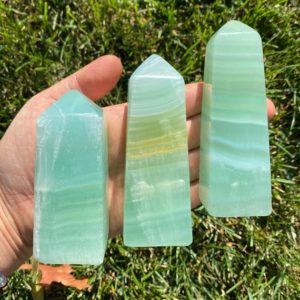 Shop Calcite Stones & Crystals! Polished Aqua Calcite Towers (2.75" – 6") – Aqua Calcite Points – Pistachio Calcite Towers – blue green calcite crystal – healing crystals | Natural genuine stones & crystals in various shapes & sizes. Buy raw cut, tumbled, or polished gemstones for making jewelry or crystal healing energy vibration raising reiki stones. #crystals #gemstones #crystalhealing #crystalsandgemstones #energyhealing #affiliate #ad