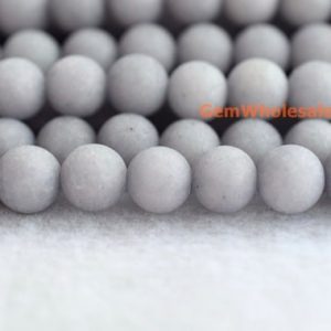 Shop Jade Beads! 15.25" Grey matte dyed jade  6mm/8mm/10mm/12mm round beads, Grey color jade beads, Grey gemstone, semi-precious stone, frosted grey jade | Natural genuine beads Jade beads for beading and jewelry making.  #jewelry #beads #beadedjewelry #diyjewelry #jewelrymaking #beadstore #beading #affiliate #ad