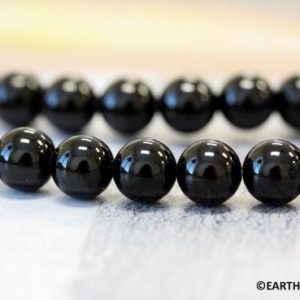 Shop Onyx Round Beads! M/ Black Onyx 8mm/ 9mm Smooth Round beads 16" strand Everlasting Classic Dyed Black Onyx beads for any kind of jewelry designs | Natural genuine round Onyx beads for beading and jewelry making.  #jewelry #beads #beadedjewelry #diyjewelry #jewelrymaking #beadstore #beading #affiliate #ad