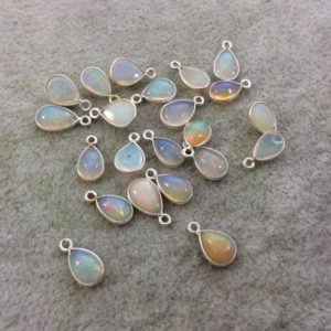 Shop Opal Pendants! Sterling Silver Smooth Teardrop/Pear Shaped Genuine Ethiopian Opal Bezel Pendant – Measuring 6-8mm x 8-9mm – Sold Individually, Random | Natural genuine Opal pendants. Buy crystal jewelry, handmade handcrafted artisan jewelry for women.  Unique handmade gift ideas. #jewelry #beadedpendants #beadedjewelry #gift #shopping #handmadejewelry #fashion #style #product #pendants #affiliate #ad
