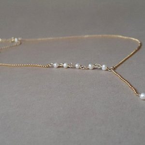 Shop Pearl Necklaces! Gold pearl necklace, gift for women, Y pearl necklace, June birthstone, minimalist jewelry | Natural genuine Pearl necklaces. Buy crystal jewelry, handmade handcrafted artisan jewelry for women.  Unique handmade gift ideas. #jewelry #beadednecklaces #beadedjewelry #gift #shopping #handmadejewelry #fashion #style #product #necklaces #affiliate #ad