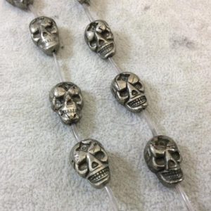 Shop Pyrite Bead Shapes! 13mm x 18mm Smooth Natural Metallic Pyrite Flattened Skull Shaped Beads with 1mm Holes – 15.25" Strand (Approx. 13 Beads) – Quality Gemstone | Natural genuine other-shape Pyrite beads for beading and jewelry making.  #jewelry #beads #beadedjewelry #diyjewelry #jewelrymaking #beadstore #beading #affiliate #ad