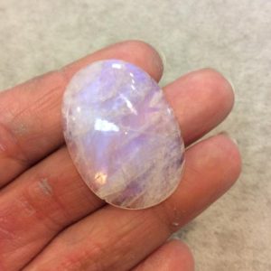 AAA Oval Shaped Rainbow Moonstone Flat Back Cabochon with Small Chip – Measuring 27mm x 37mm, 6mm Dome Height – Natural Gemstone Cab | Natural genuine chip Rainbow Moonstone beads for beading and jewelry making.  #jewelry #beads #beadedjewelry #diyjewelry #jewelrymaking #beadstore #beading #affiliate #ad