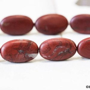 Shop Red Jasper Bead Shapes! L/ Matte Red Jasper 16x25mm Flat Oval beads 15.5 inches long, Natural Jasper Matte Finished Oval, For Crafts, DIY Jewelry Making | Natural genuine other-shape Red Jasper beads for beading and jewelry making.  #jewelry #beads #beadedjewelry #diyjewelry #jewelrymaking #beadstore #beading #affiliate #ad