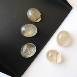 Shop Rutilated Quartz Cabochons! 20 Pieces 10x8mm Each Gold Rutilated Quartz Oval Shaped Flat Back Loose Cabochons BB238 | Natural genuine stones & crystals in various shapes & sizes. Buy raw cut, tumbled, or polished gemstones for making jewelry or crystal healing energy vibration raising reiki stones. #crystals #gemstones #crystalhealing #crystalsandgemstones #energyhealing #affiliate #ad
