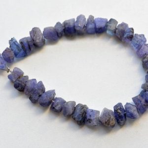 Shop Tanzanite Bead Shapes! Rough Tanzanite Beads, Tanzanite Gemstone Raw Beads, Raw Gemstone Briolettes, Rough Gemstone Beads 8mm To 11mm, 6 Inch Strand | Natural genuine other-shape Tanzanite beads for beading and jewelry making.  #jewelry #beads #beadedjewelry #diyjewelry #jewelrymaking #beadstore #beading #affiliate #ad