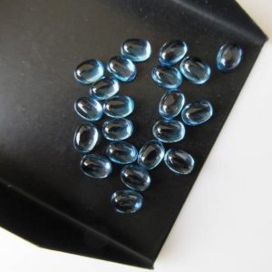 Shop Topaz Cabochons! 10 Pieces 7x5mm Natural Swiss Blue Topaz Smooth Oval Shaped Flat Back Loose Cabochons BB356 | Natural genuine stones & crystals in various shapes & sizes. Buy raw cut, tumbled, or polished gemstones for making jewelry or crystal healing energy vibration raising reiki stones. #crystals #gemstones #crystalhealing #crystalsandgemstones #energyhealing #affiliate #ad