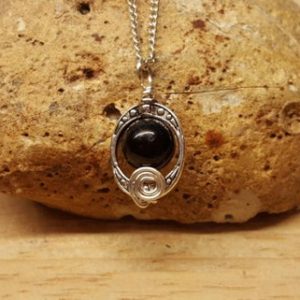 Small Black Jet pendant. Reiki jewelry uk. Oval frame pendant. Silver plated Wire wrapped necklace. 10mm stone | Natural genuine Jet jewelry. Buy crystal jewelry, handmade handcrafted artisan jewelry for women.  Unique handmade gift ideas. #jewelry #beadedjewelry #beadedjewelry #gift #shopping #handmadejewelry #fashion #style #product #jewelry #affiliate #ad