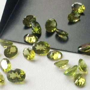 Shop Peridot Necklaces! 8-9mm Peridot Oval Cut Stone Lot, Oval Cut Faceted Peridot, Loose Peridot For Jewelry, Green Gems For Necklace (2Pcs To 10Pcs Options) | Natural genuine Peridot necklaces. Buy crystal jewelry, handmade handcrafted artisan jewelry for women.  Unique handmade gift ideas. #jewelry #beadednecklaces #beadedjewelry #gift #shopping #handmadejewelry #fashion #style #product #necklaces #affiliate #ad