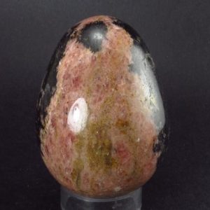 Shop Rhodonite Shapes! Large Rhodonite Egg From Canada – 303 Grams – 2.7" | Natural genuine stones & crystals in various shapes & sizes. Buy raw cut, tumbled, or polished gemstones for making jewelry or crystal healing energy vibration raising reiki stones. #crystals #gemstones #crystalhealing #crystalsandgemstones #energyhealing #affiliate #ad